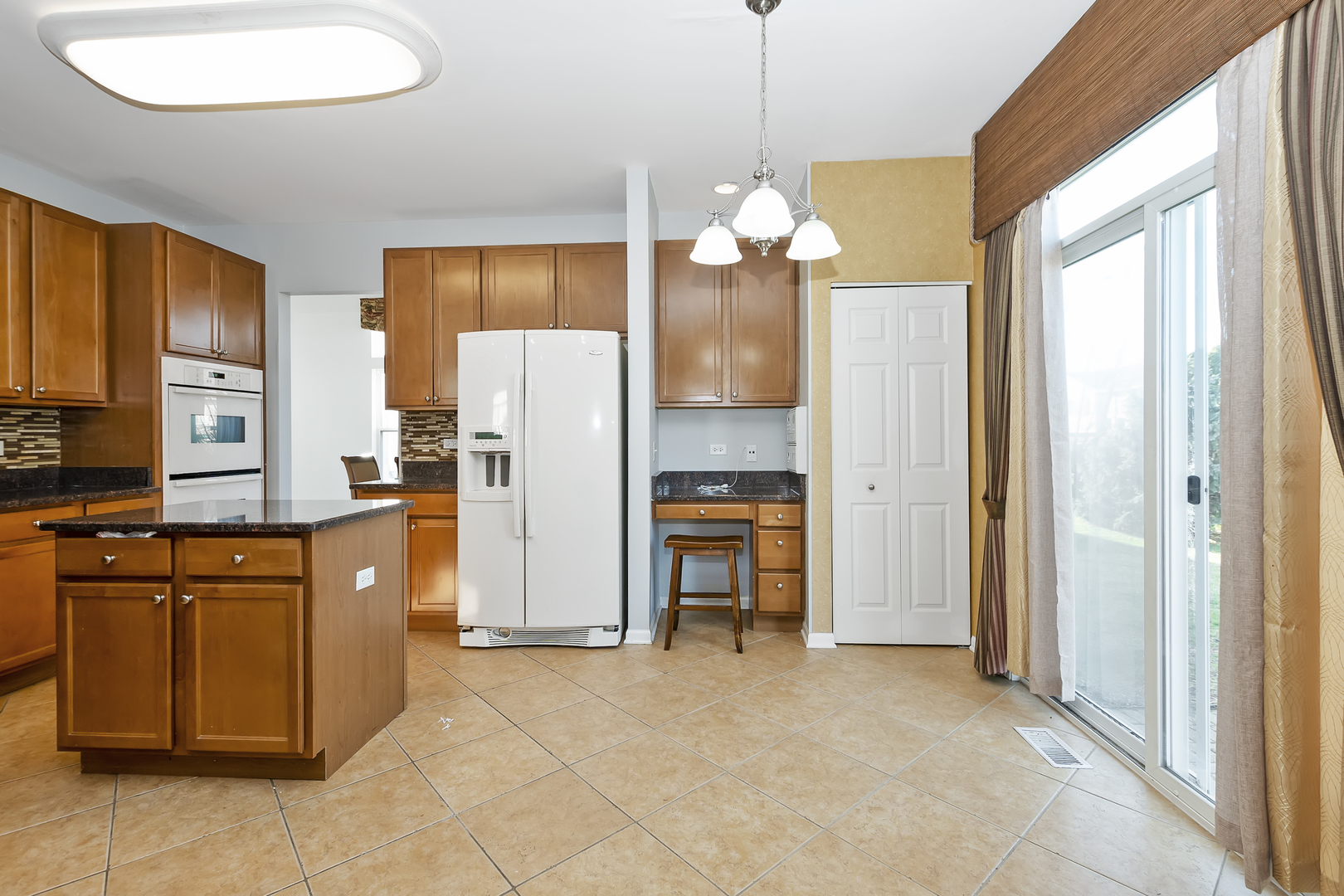 1010 Eagle Point Drive Matteson, IL 60443 - Photo 10 of 27 a kitchen with stainless steel appliances granite countertop a refrigerator a oven a sink dishwasher and a dining table with the view of kitchen