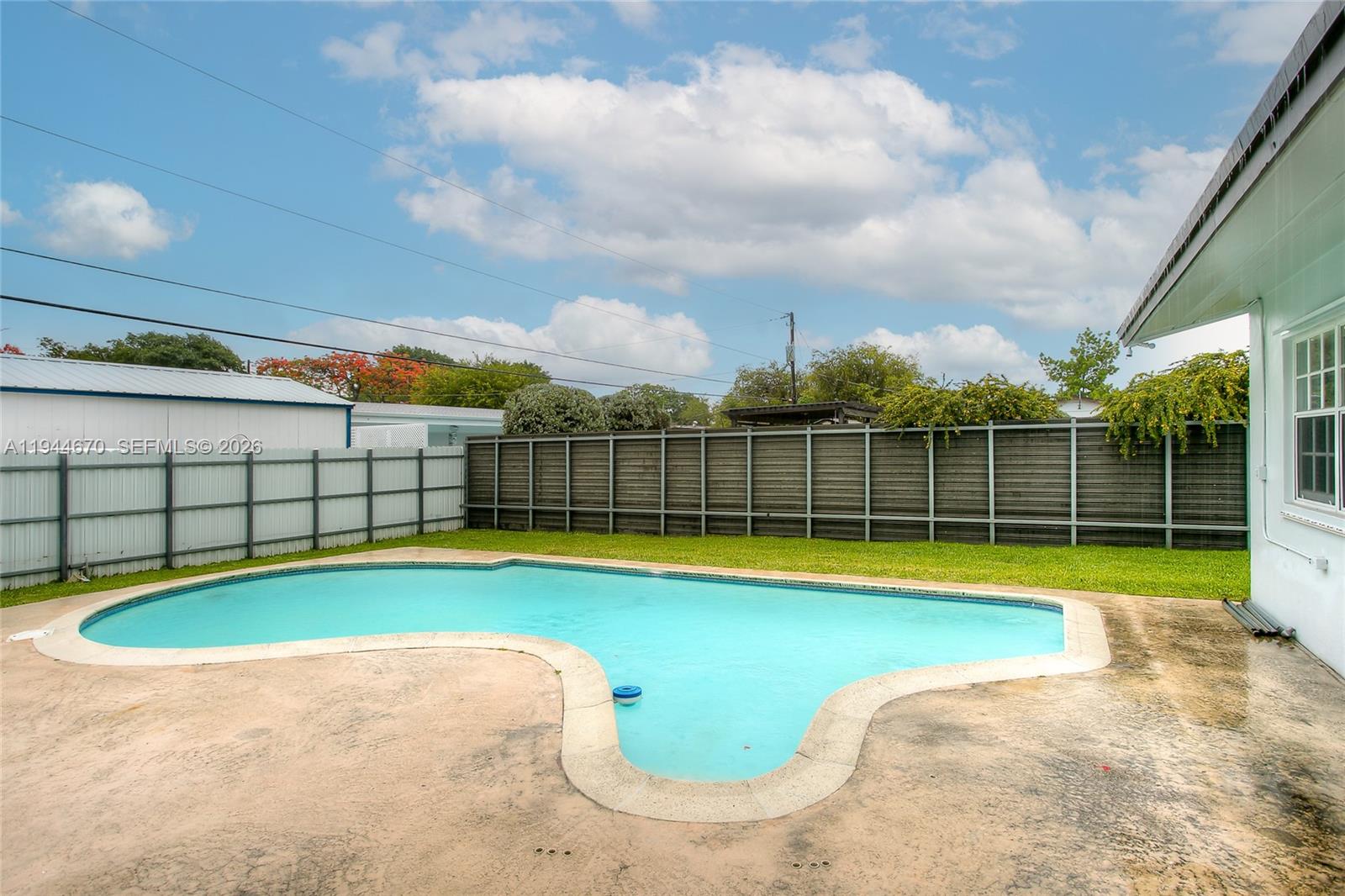 9825 Southwest 196th Street Cutler Bay, FL 33157 - Photo 14 of 14 a view of a backyard with swimming pool