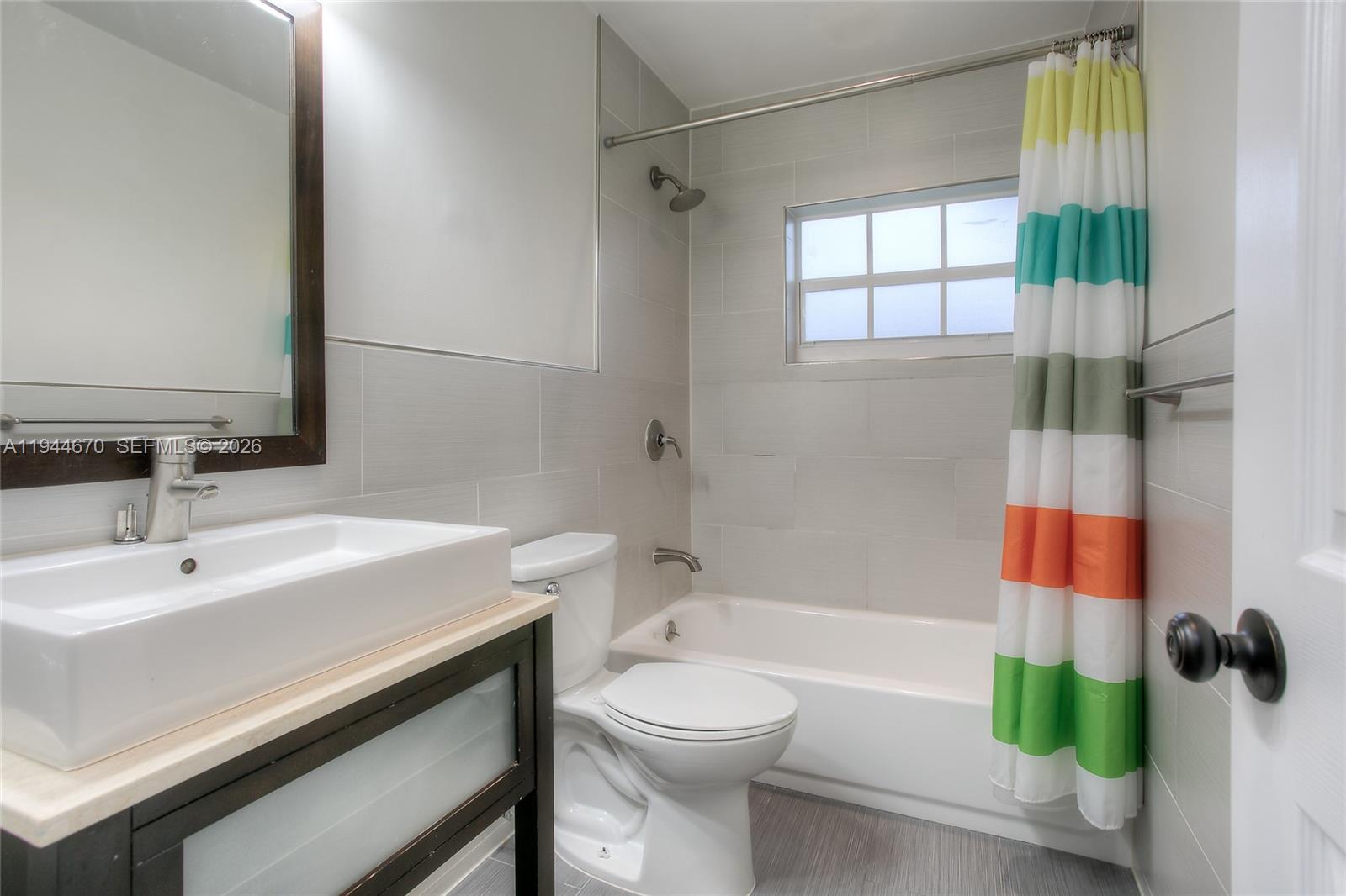 9825 Southwest 196th Street Cutler Bay, FL 33157 - Photo 10 of 14 a bathroom with a sink a toilet and shower