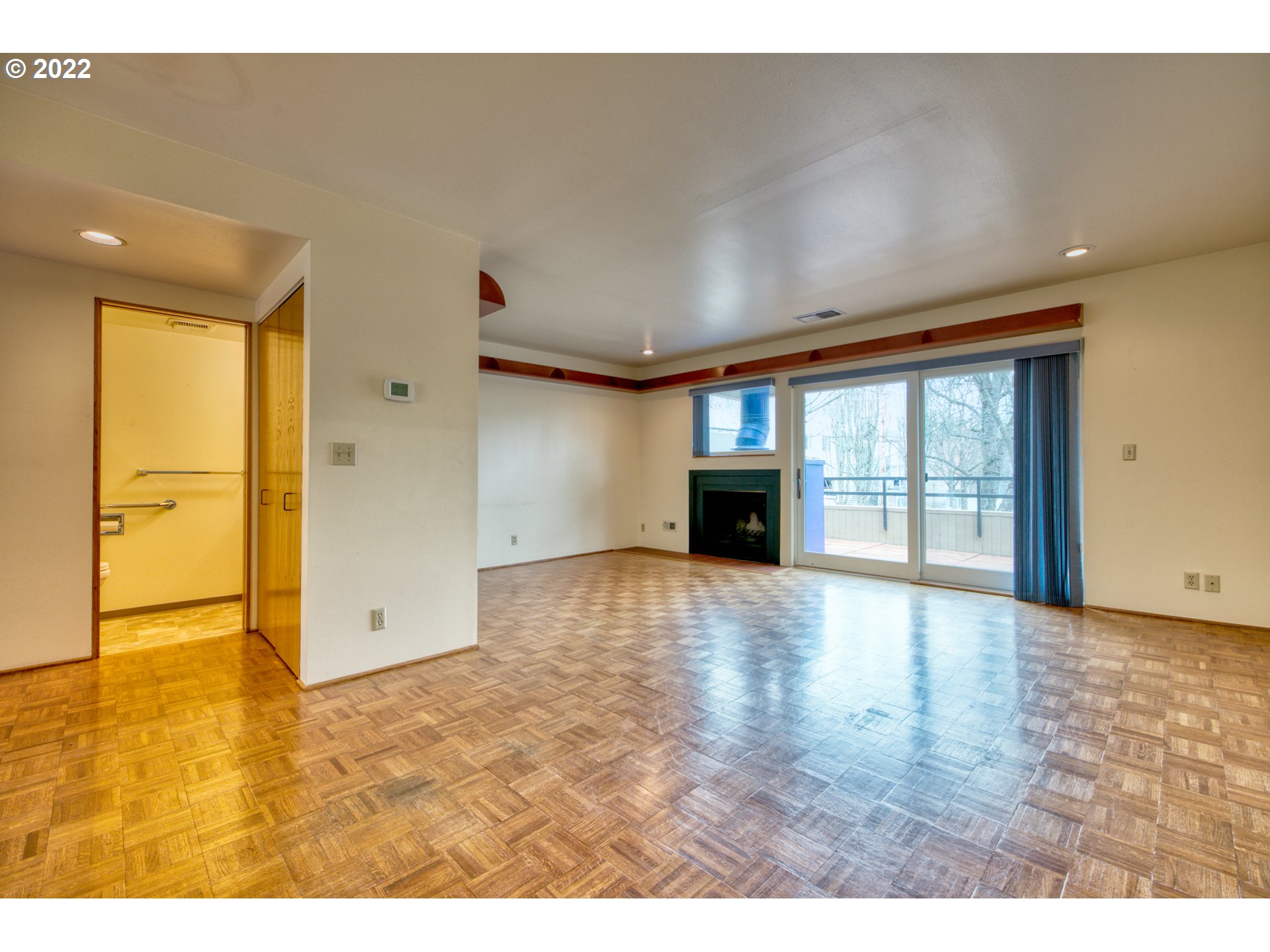 974 Lincoln Street Eugene, OR 97401 - Photo 11 of 32 a view of an empty room with window and wooden floor