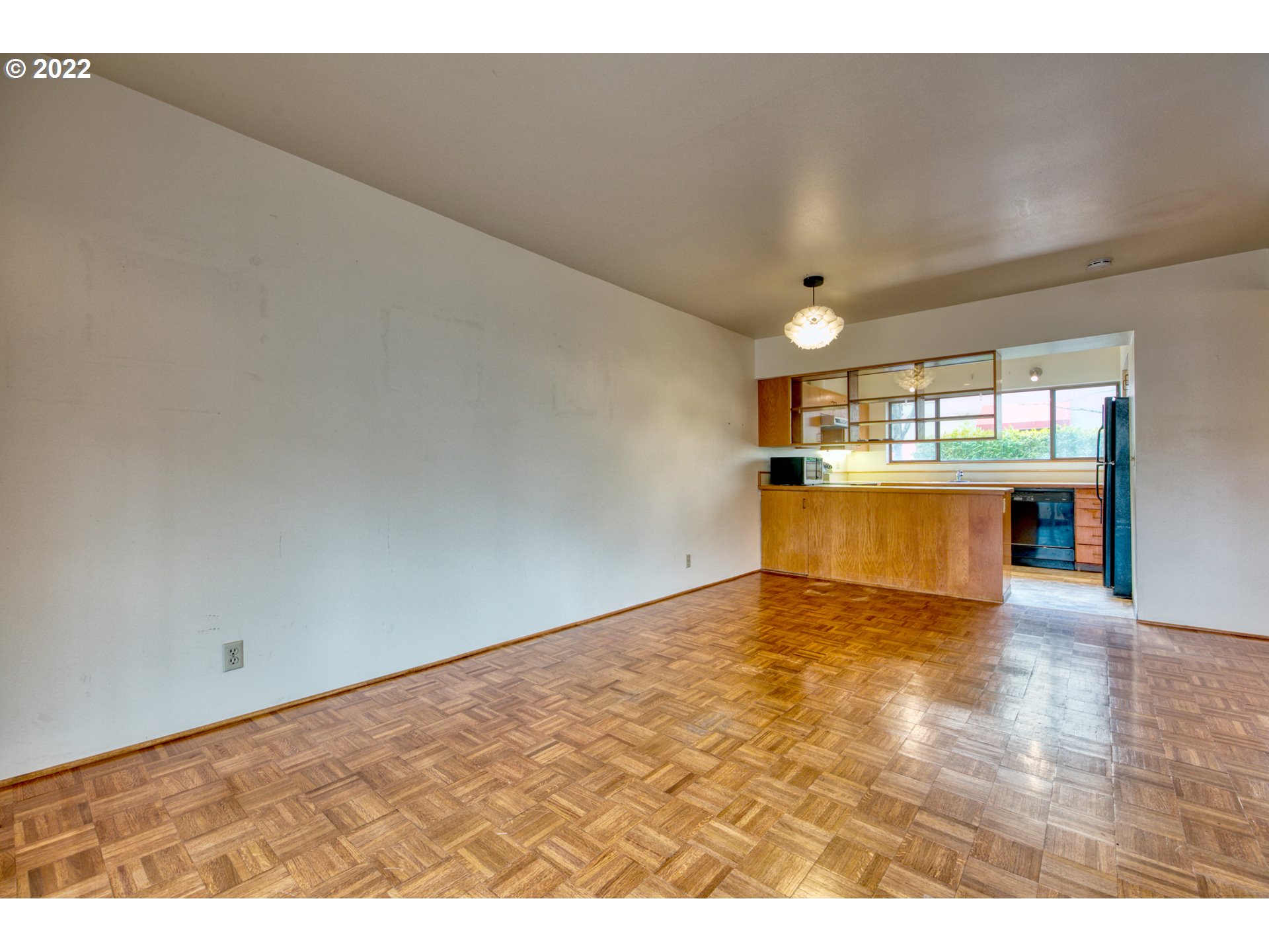 974 Lincoln Street Eugene, OR 97401 - Photo 14 of 32 a view of empty room with wooden floor