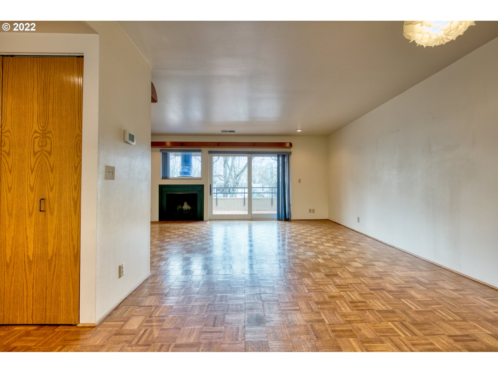 974 Lincoln Street Eugene, OR 97401 - Photo 10 of 32 a view of an empty room with wooden floor and a window