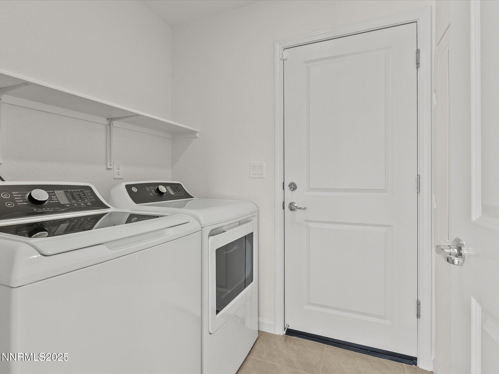 8838 Finnsech Drive Reno, NV 89506 - Photo 19 of 44 a utility room with dryer and washer