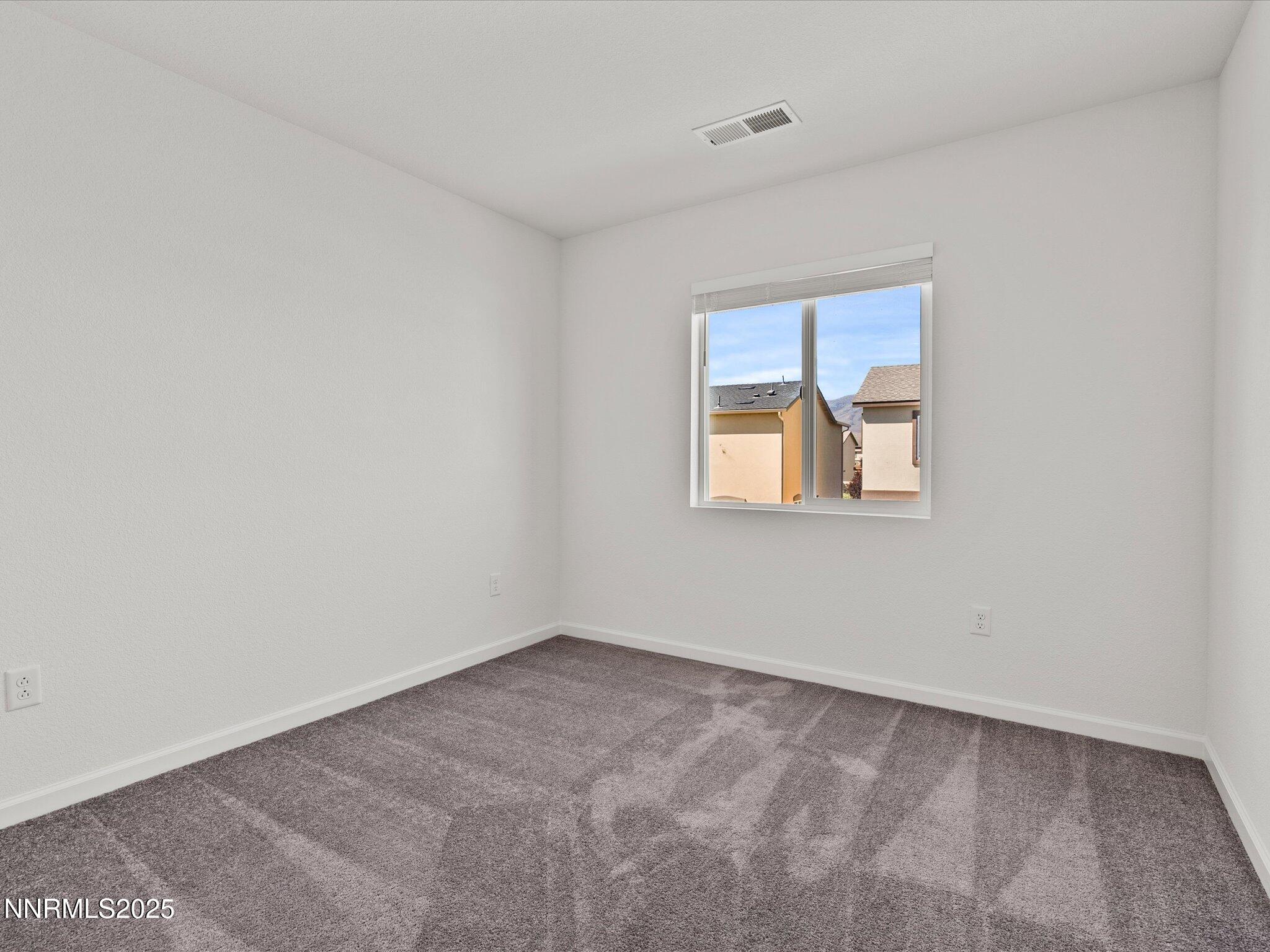8838 Finnsech Drive Reno, NV 89506 - Photo 20 of 44 an empty room with a window