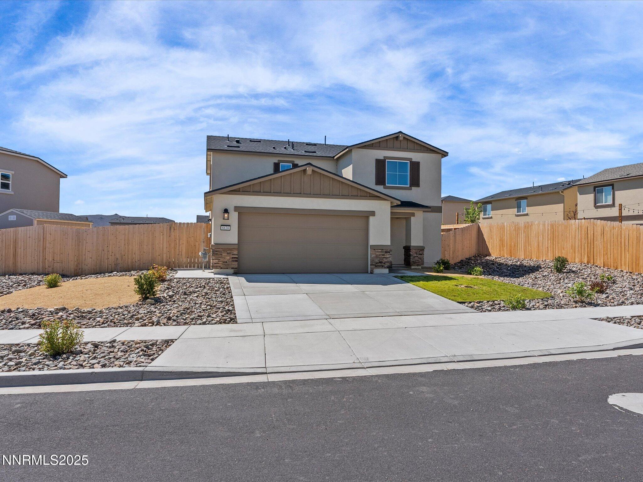 8838 Finnsech Drive Reno, NV 89506 - Photo 2 of 44 front view of a house with a yard