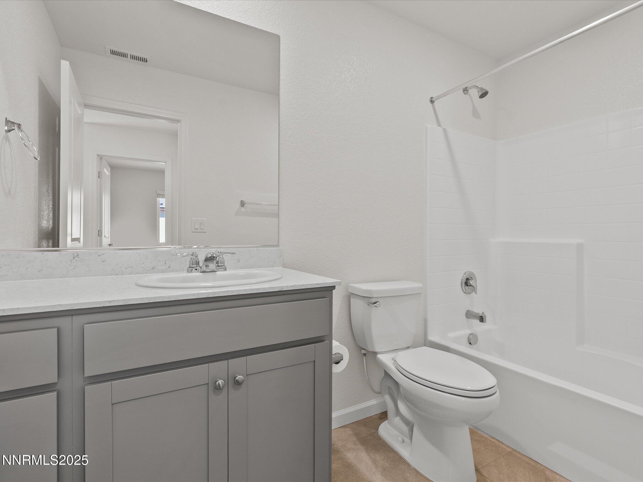 8838 Finnsech Drive Reno, NV 89506 - Photo 22 of 44 a bathroom with a sink a toilet and shower