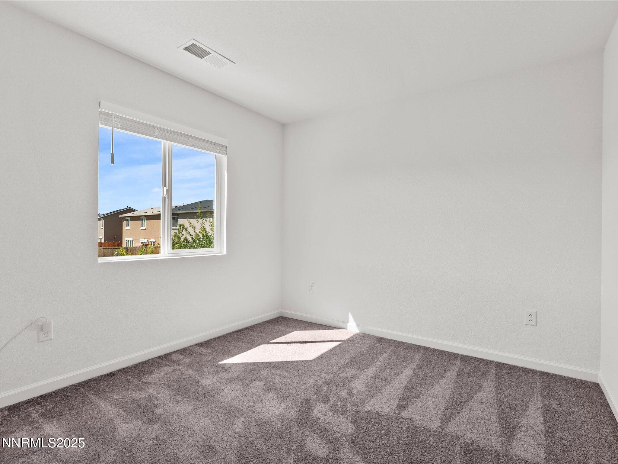 8838 Finnsech Drive Reno, NV 89506 - Photo 23 of 44 an empty room with a window