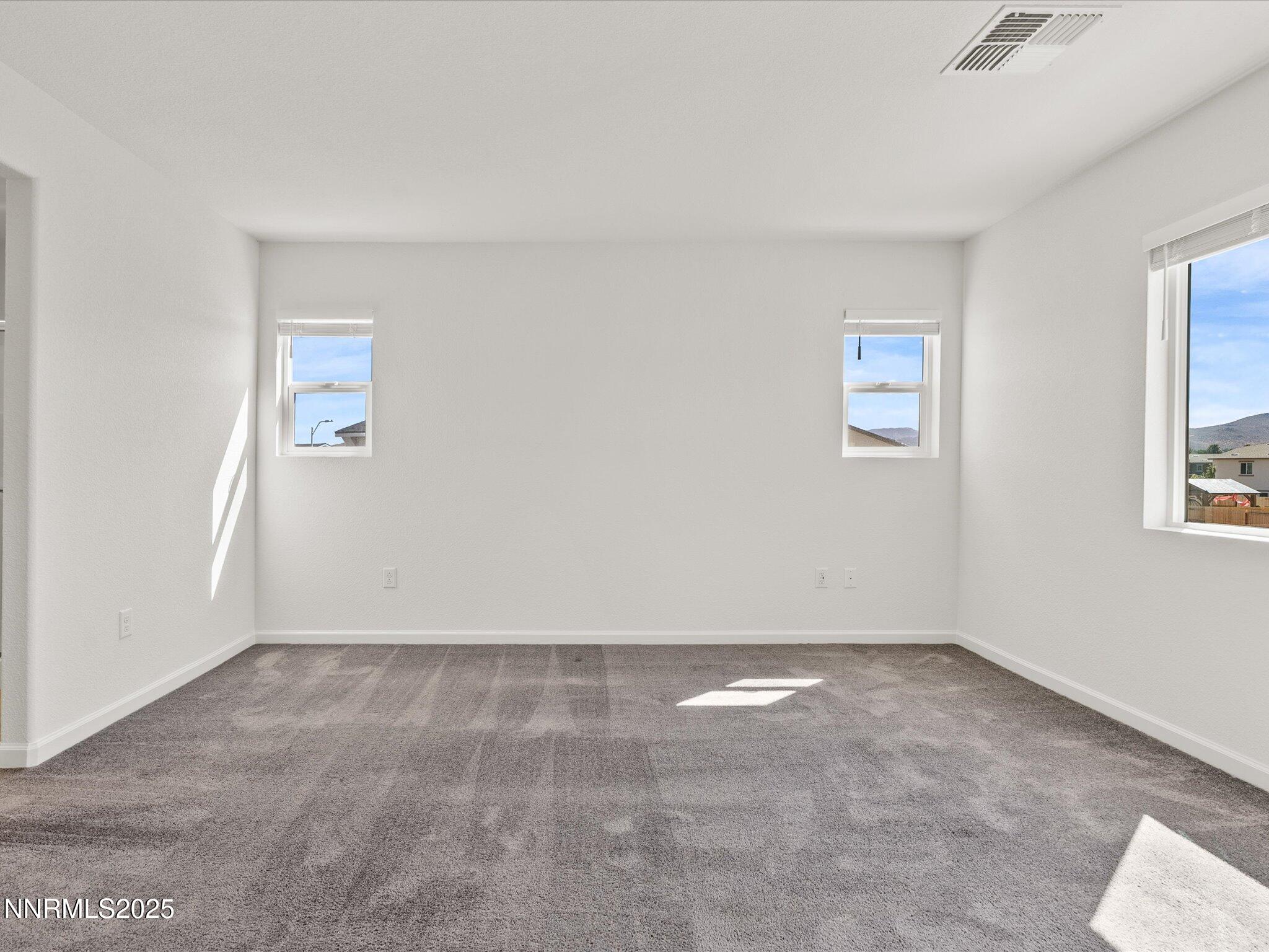 8838 Finnsech Drive Reno, NV 89506 - Photo 25 of 44 an empty room with windows