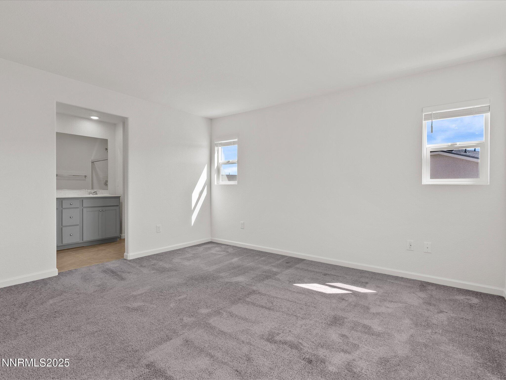 8838 Finnsech Drive Reno, NV 89506 - Photo 27 of 44 an empty room with a bathroom