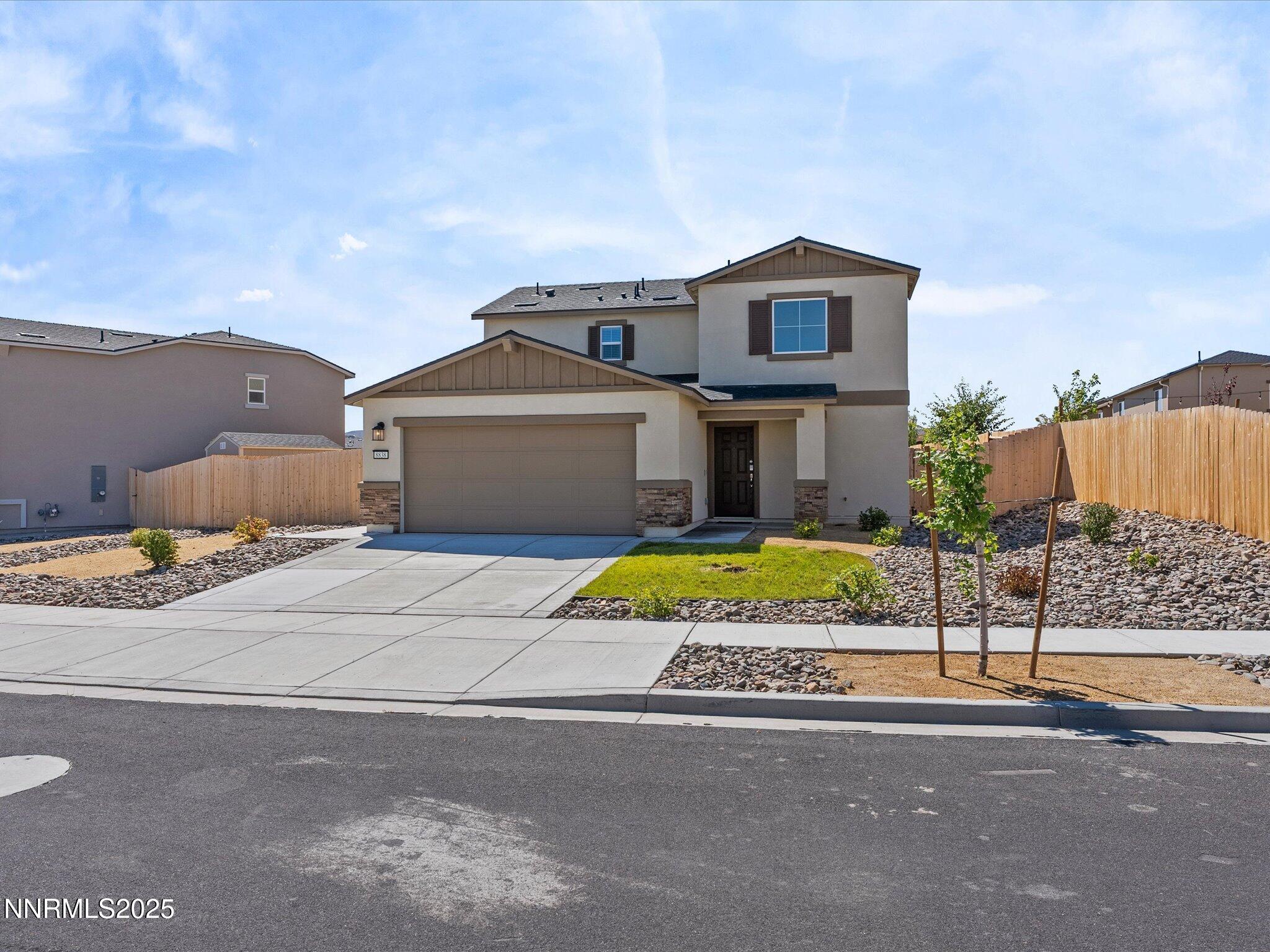 8838 Finnsech Drive Reno, NV 89506 - Photo 3 of 44 a view of a house with a yard and fence