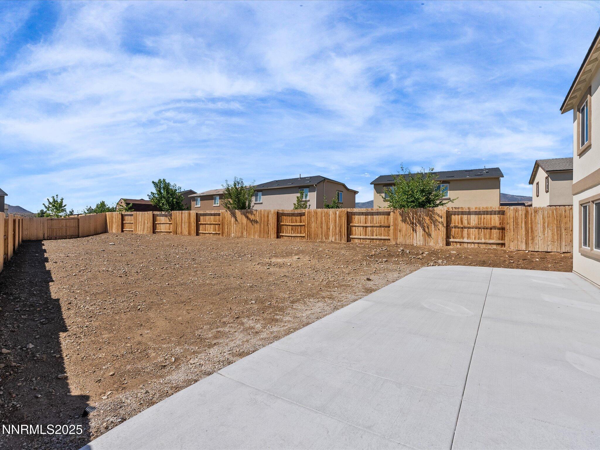 8838 Finnsech Drive Reno, NV 89506 - Photo 31 of 44 a view of building with a yard