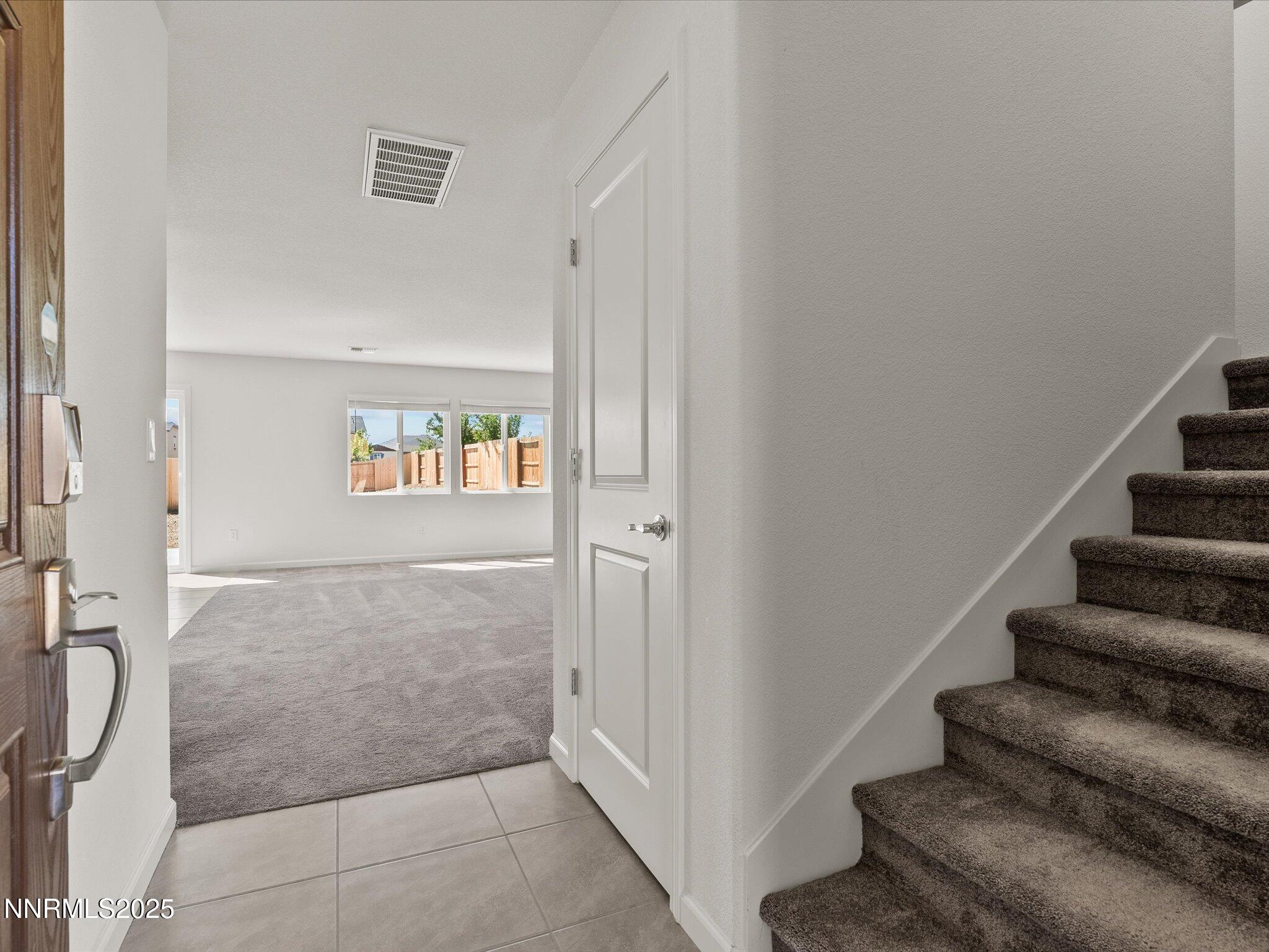 8838 Finnsech Drive Reno, NV 89506 - Photo 5 of 44 a view of an entryway with staircase