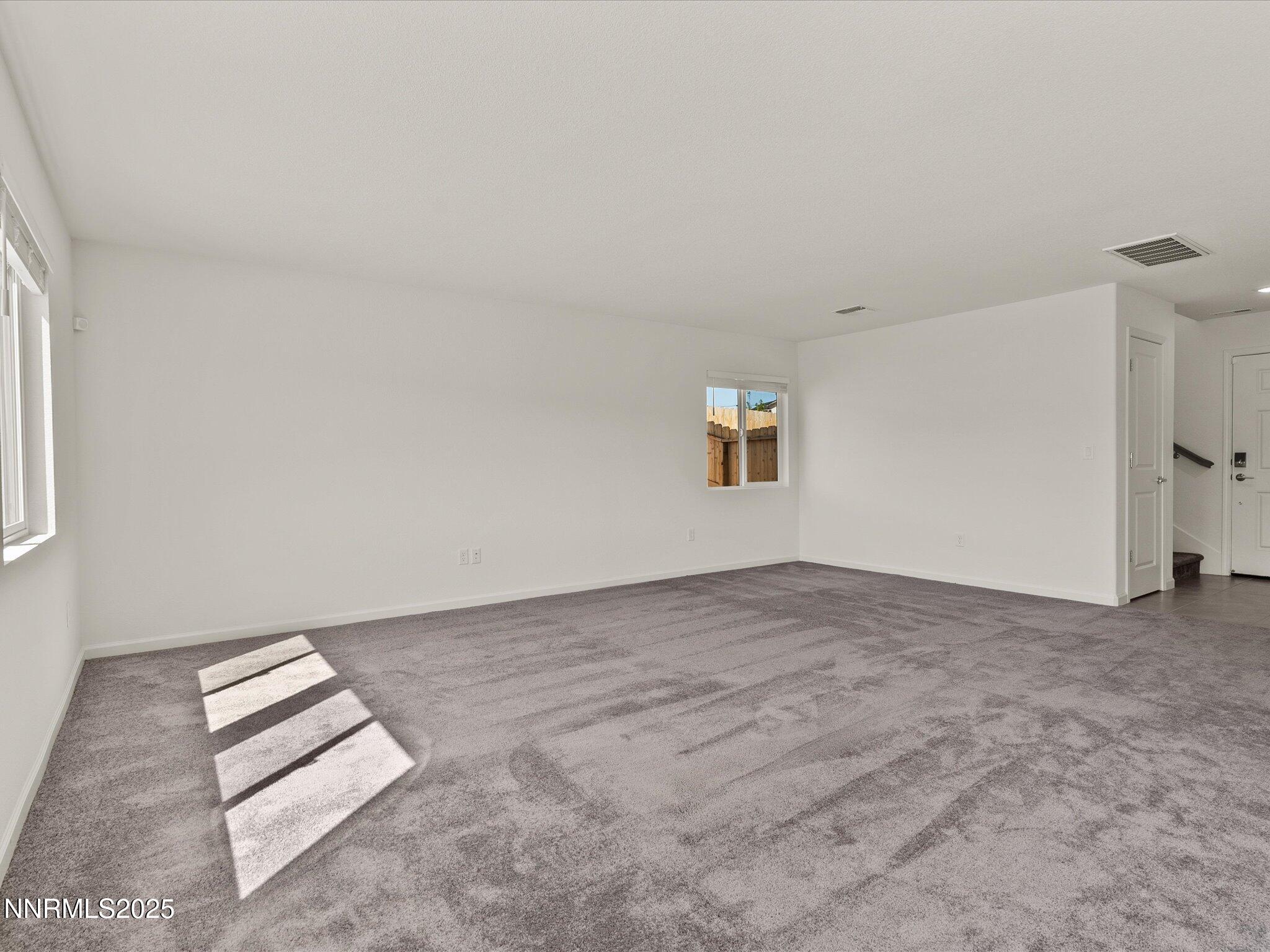 8838 Finnsech Drive Reno, NV 89506 - Photo 7 of 44 an empty room with windows