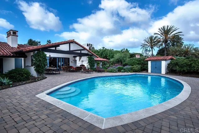 a view of a swimming pool with a patio