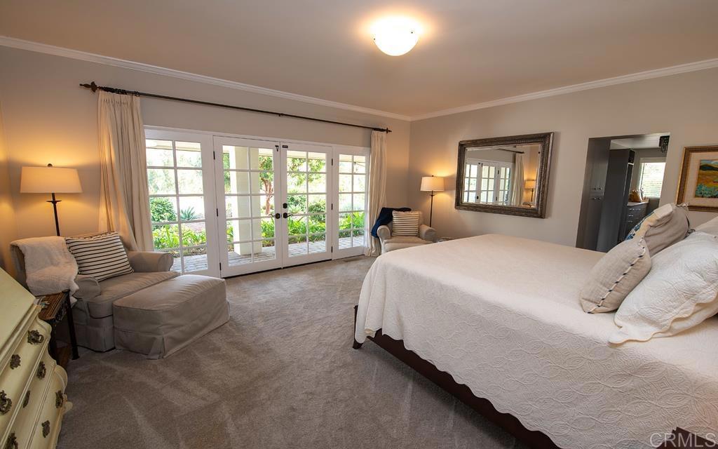 17925 Avenida Alondra Rancho Santa Fe, CA 92067 - Photo 2 of 11 a spacious bedroom with a bed and a couch