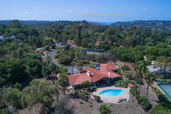 an aerial view of a house with outdoor space