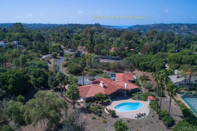 an aerial view of a house with outdoor space