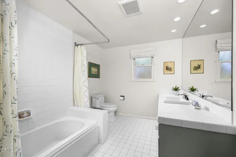 a bathroom with a bathtub a sink and a toilet