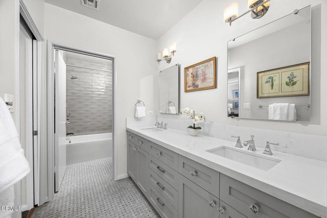 a living room with furniture and large windows