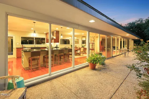 an aerial view of a house with a yard and garden