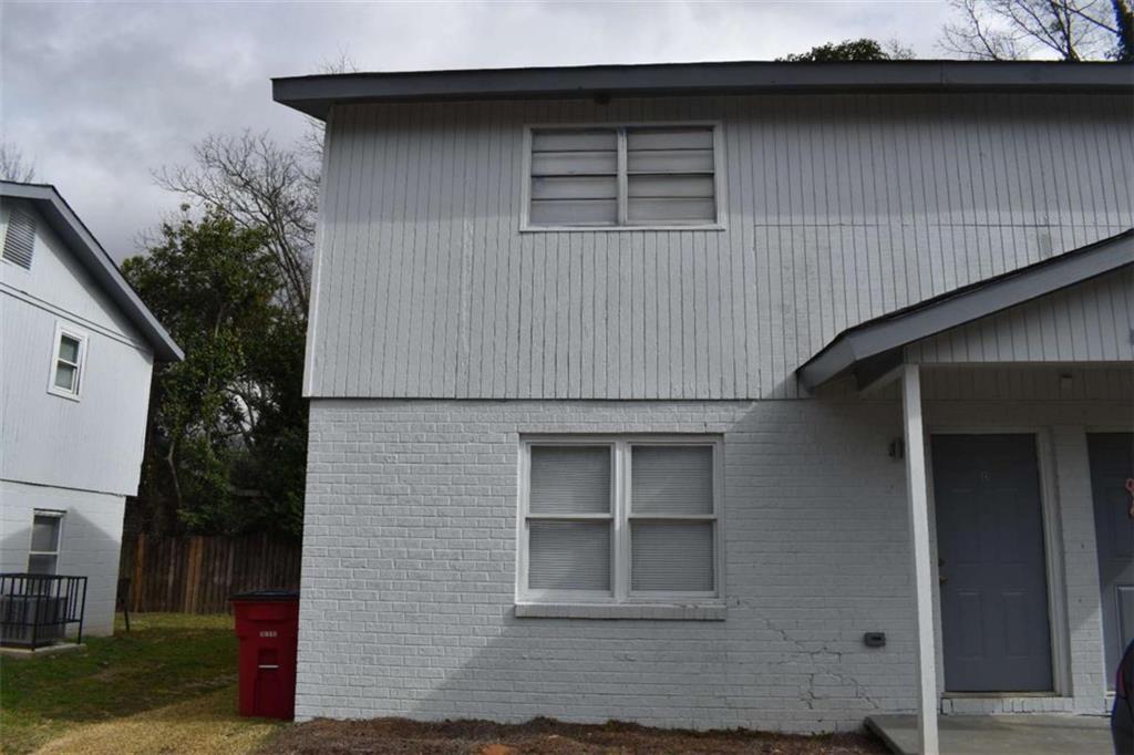 a house with trees in the background