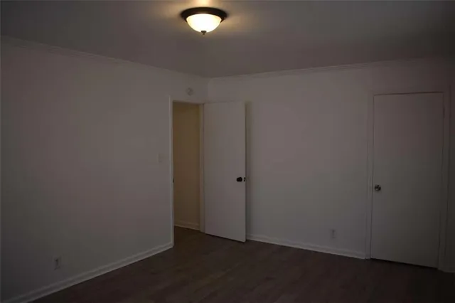 an empty room with wooden floor