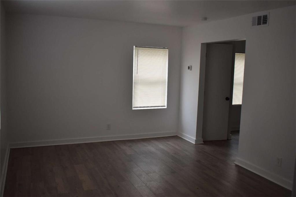 1156 Triple Hill Drive, Unit C Macon, GA 31206 - Photo 2 of 15 an empty room with wooden floor and closet
