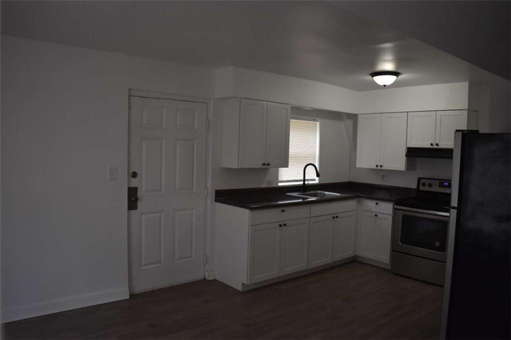 1156 Triple Hill Drive, Unit C Macon, GA 31206 - Photo 6 of 15 a kitchen with a sink and refrigerator