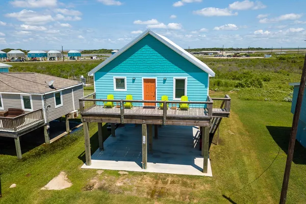 a view of house with swimming pool outdoor seating