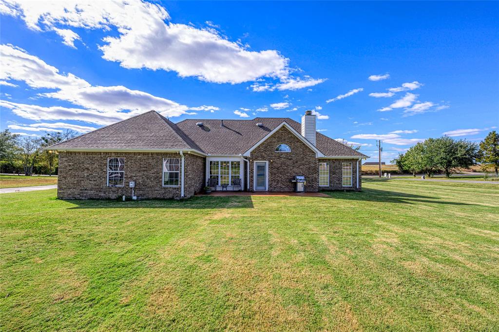 10264 Farmington Road Van Alstyne, TX 75495 - Photo 26 of 39 a front view of a house with a garden