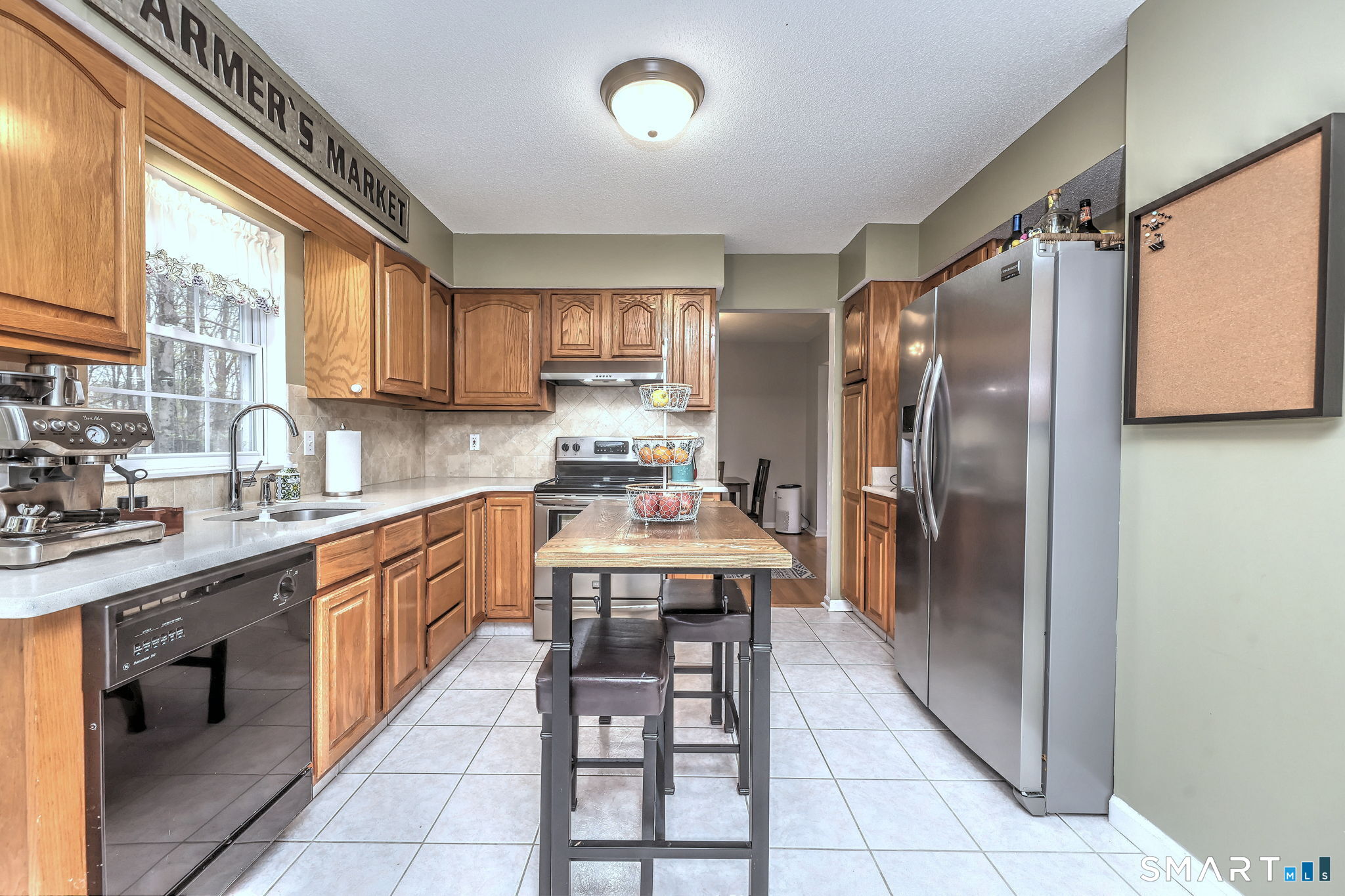 112 Finch Avenue Meriden, CT 06451 - Photo 12 of 40 a kitchen with stainless steel appliances granite countertop a refrigerator and a sink