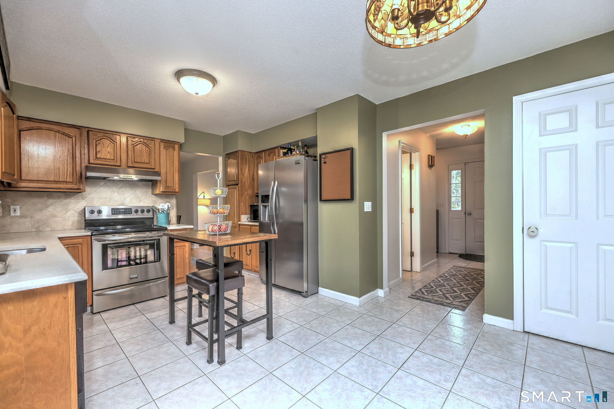 112 Finch Avenue Meriden, CT 06451 - Photo 14 of 40 a kitchen with stainless steel appliances a refrigerator and a stove top oven