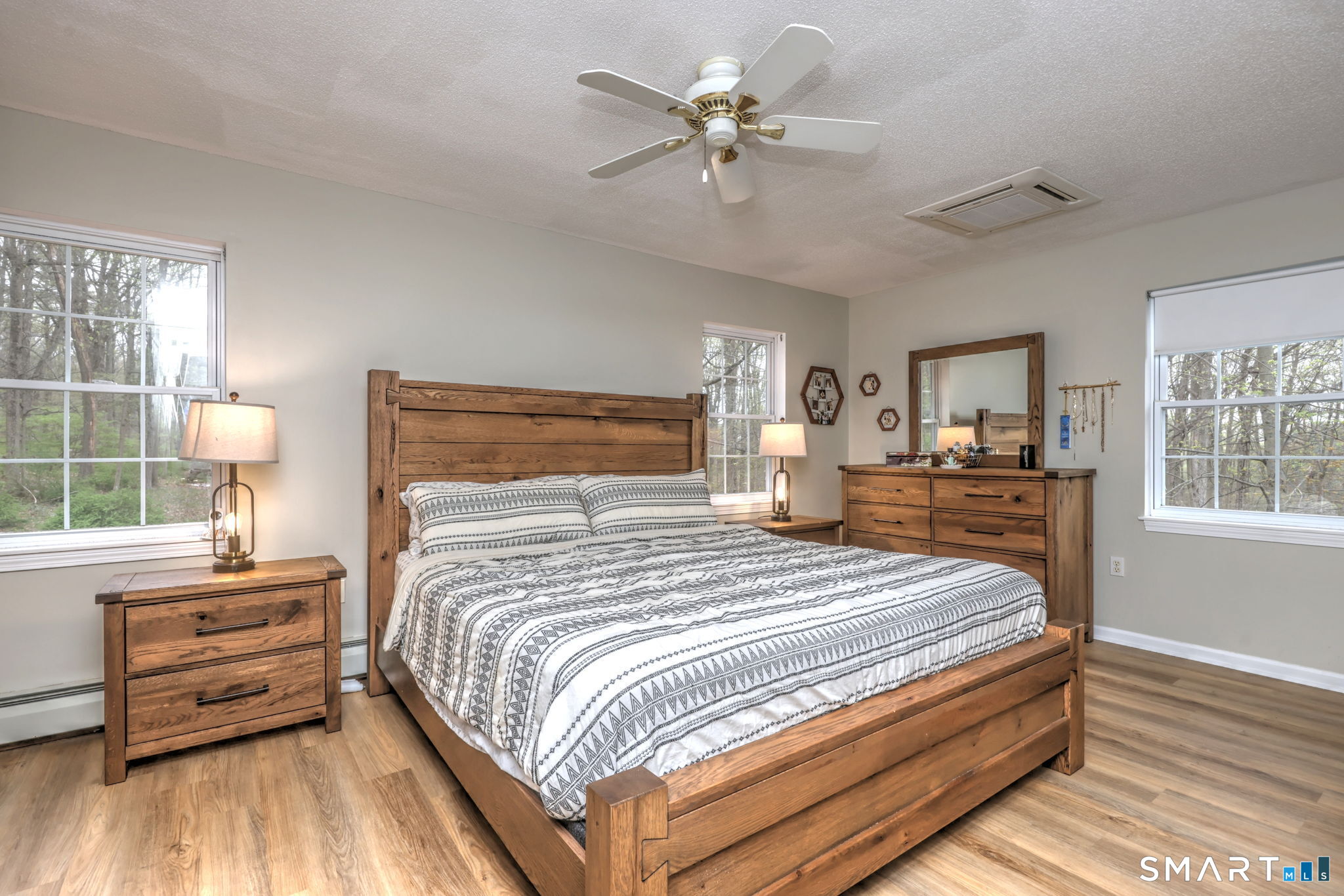 112 Finch Avenue Meriden, CT 06451 - Photo 20 of 40 a bedroom with a large bed a chandelier and windows