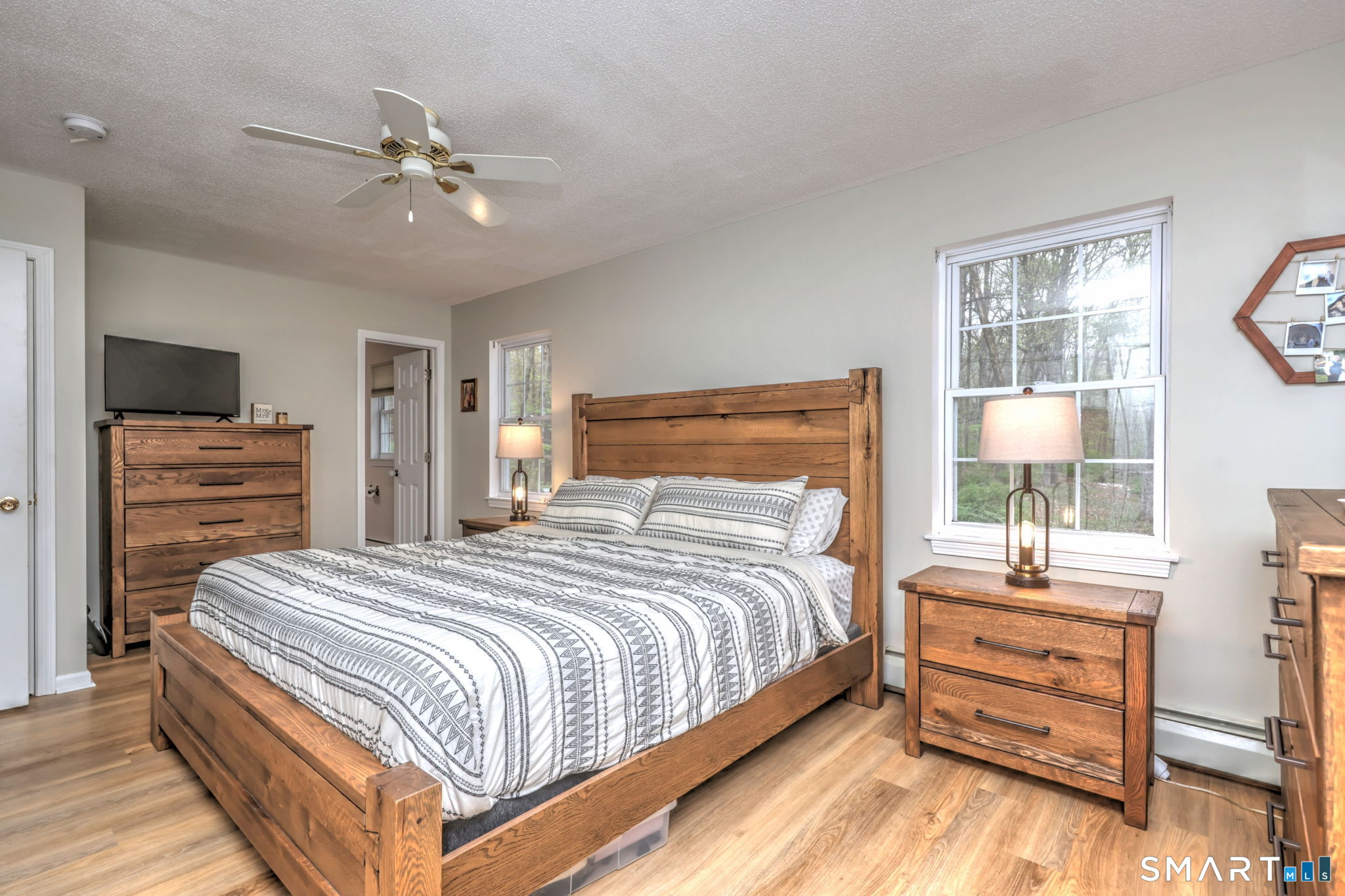 112 Finch Avenue Meriden, CT 06451 - Photo 21 of 40 a bedroom with a bed and wooden floor