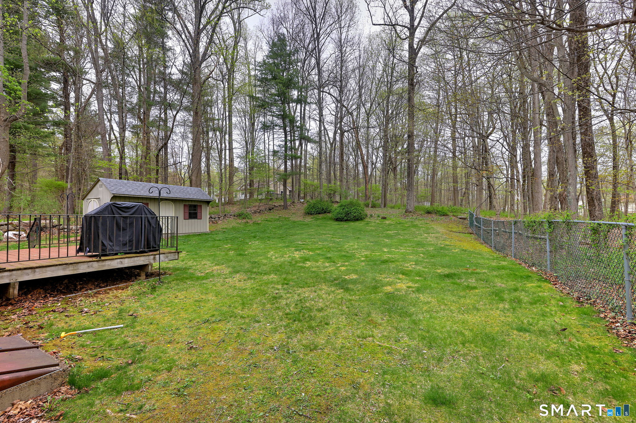112 Finch Avenue Meriden, CT 06451 - Photo 38 of 40 a view of a garden with a bench