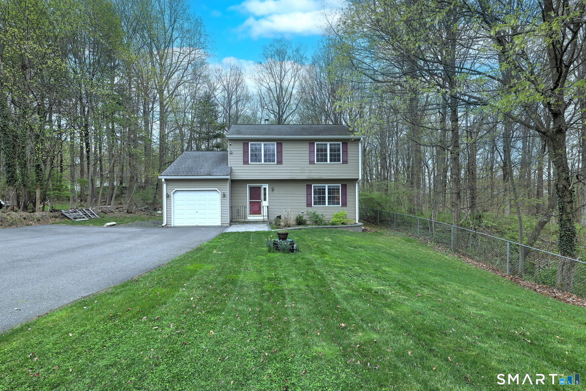 112 Finch Avenue Meriden, CT 06451 - Photo 39 of 40 a view of a brick house with a big yard and large trees