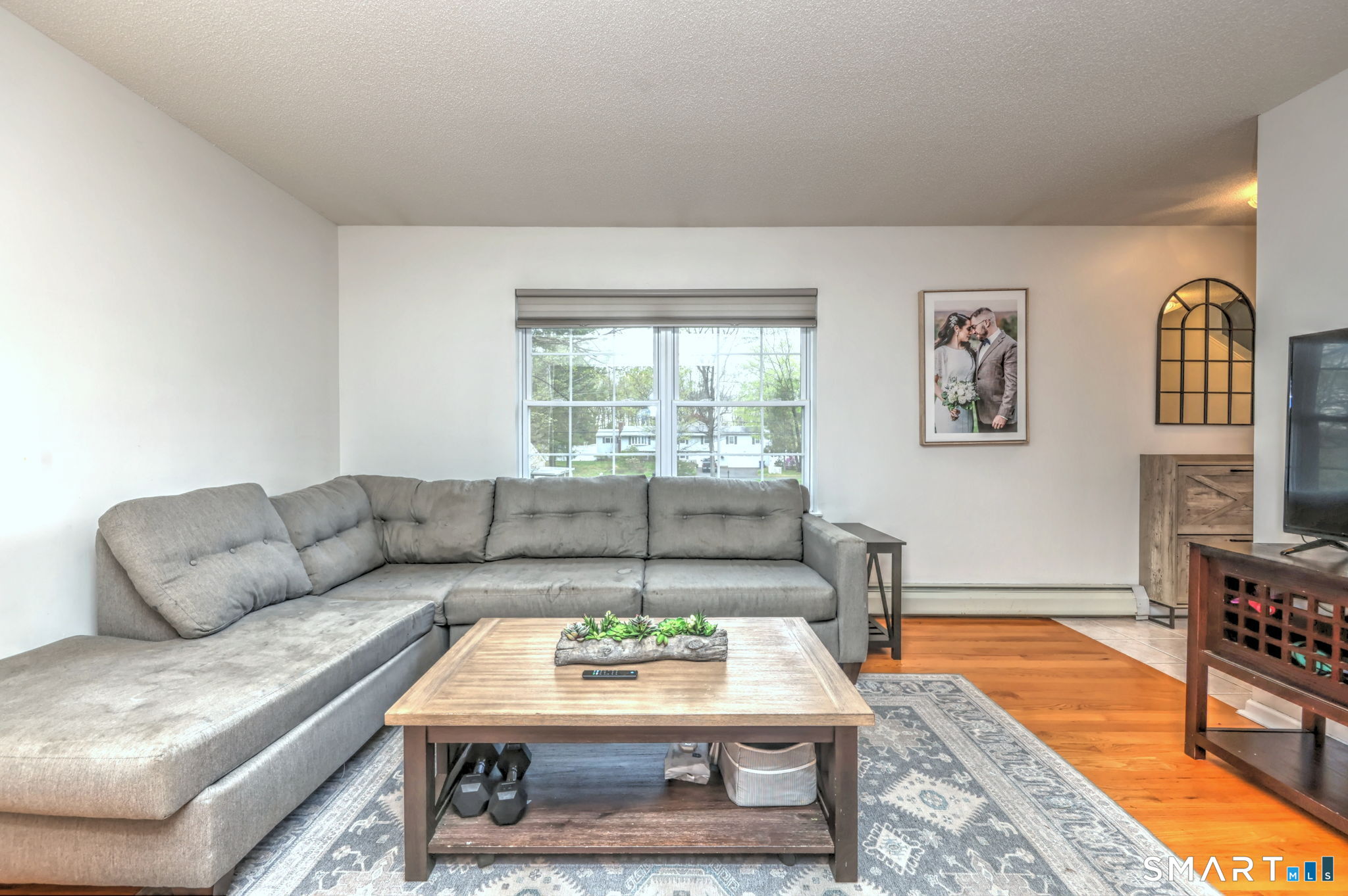 112 Finch Avenue Meriden, CT 06451 - Photo 5 of 40 a living room with furniture and a rug