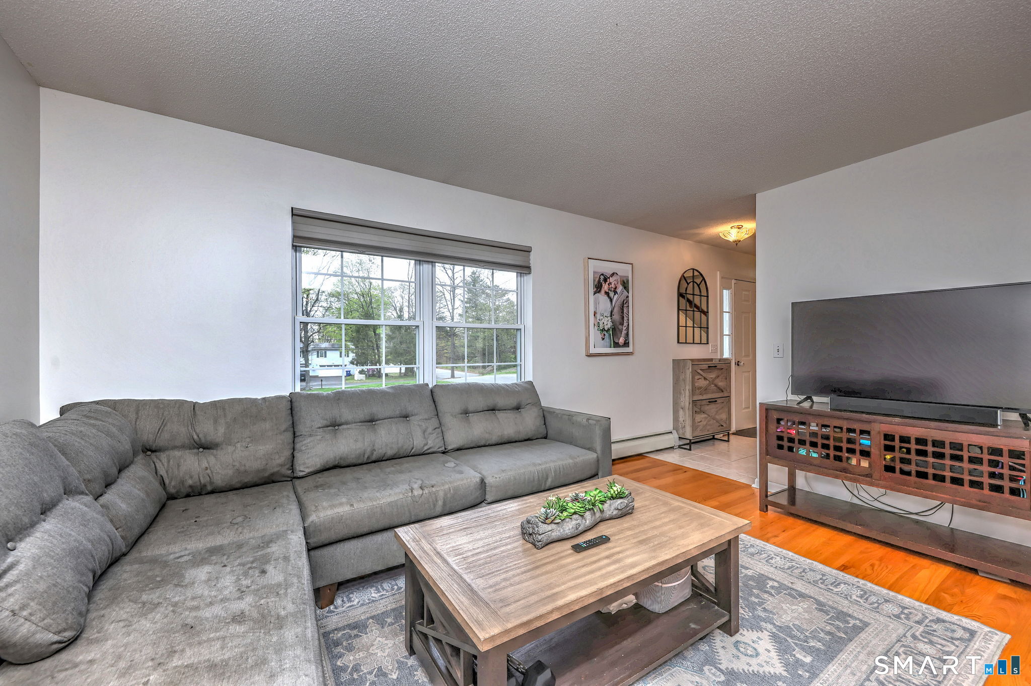 112 Finch Avenue Meriden, CT 06451 - Photo 6 of 40 a living room with furniture and a flat screen tv