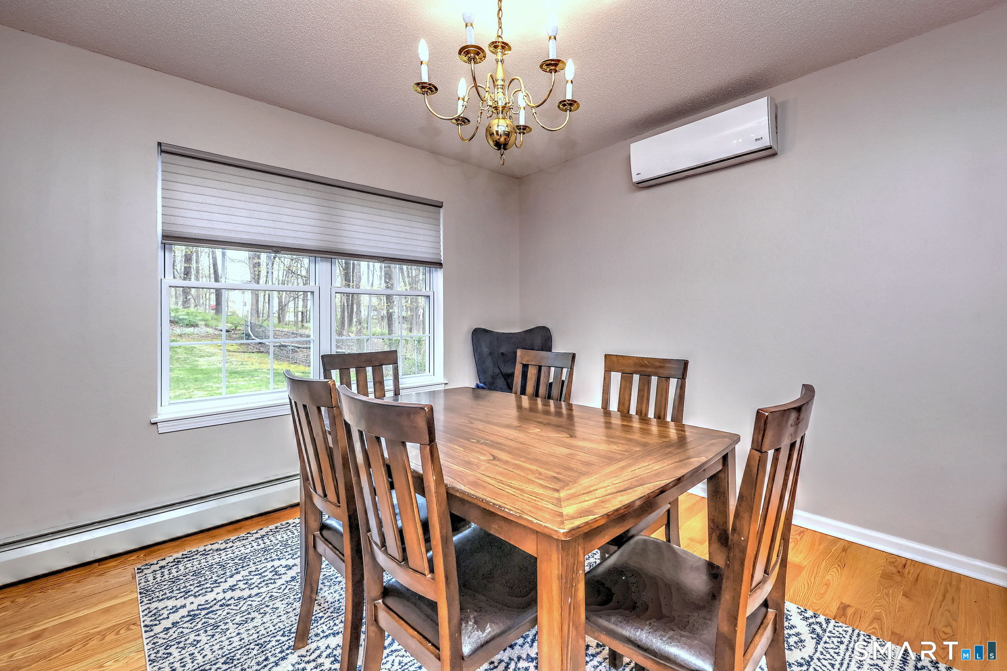 112 Finch Avenue Meriden, CT 06451 - Photo 7 of 40 a view of a dining room with furniture a chandelier and wooden floor