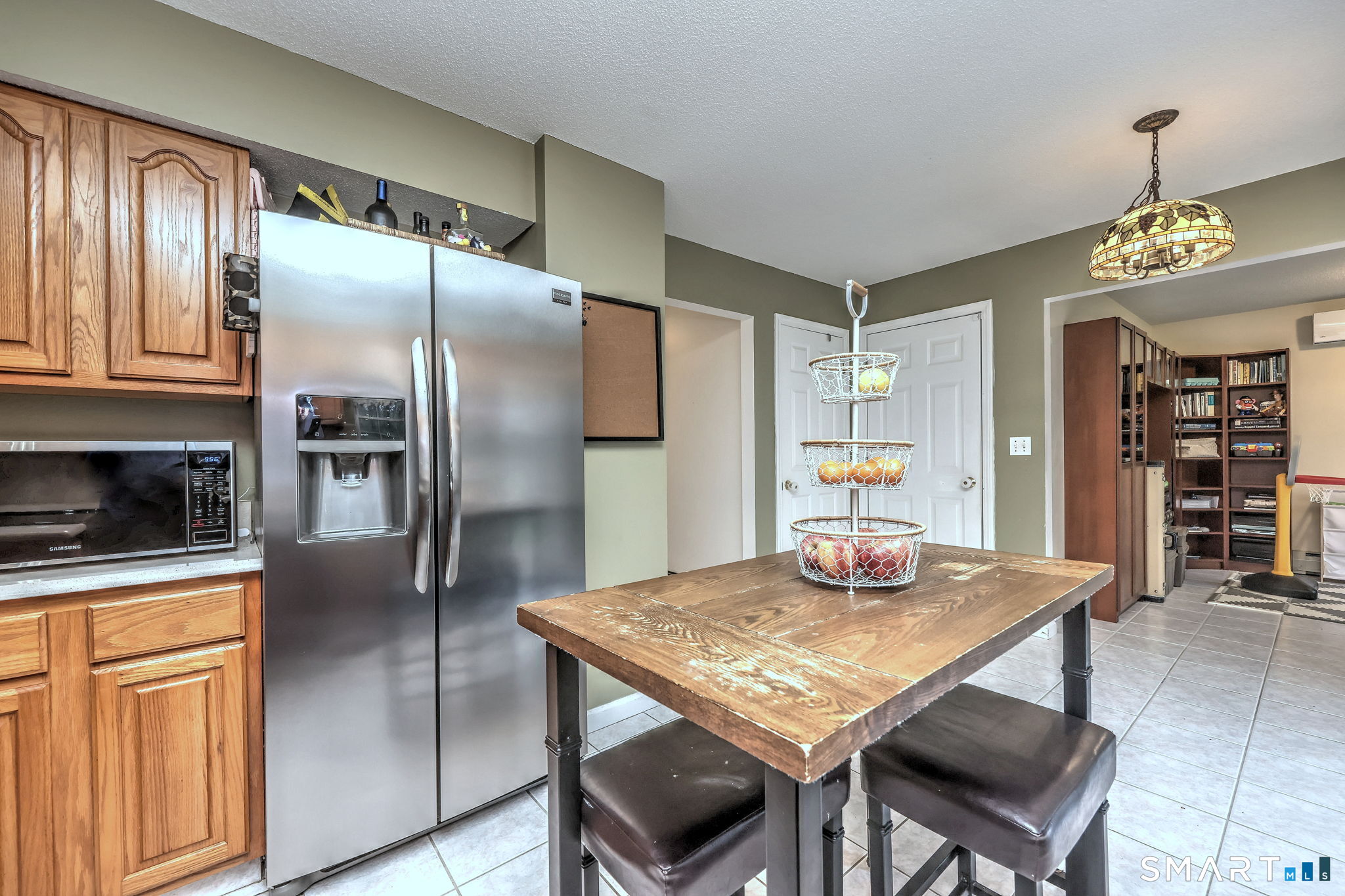 112 Finch Avenue Meriden, CT 06451 - Photo 10 of 40 a kitchen with stainless steel appliances granite countertop a refrigerator a stove and a refrigerator with wooden floor