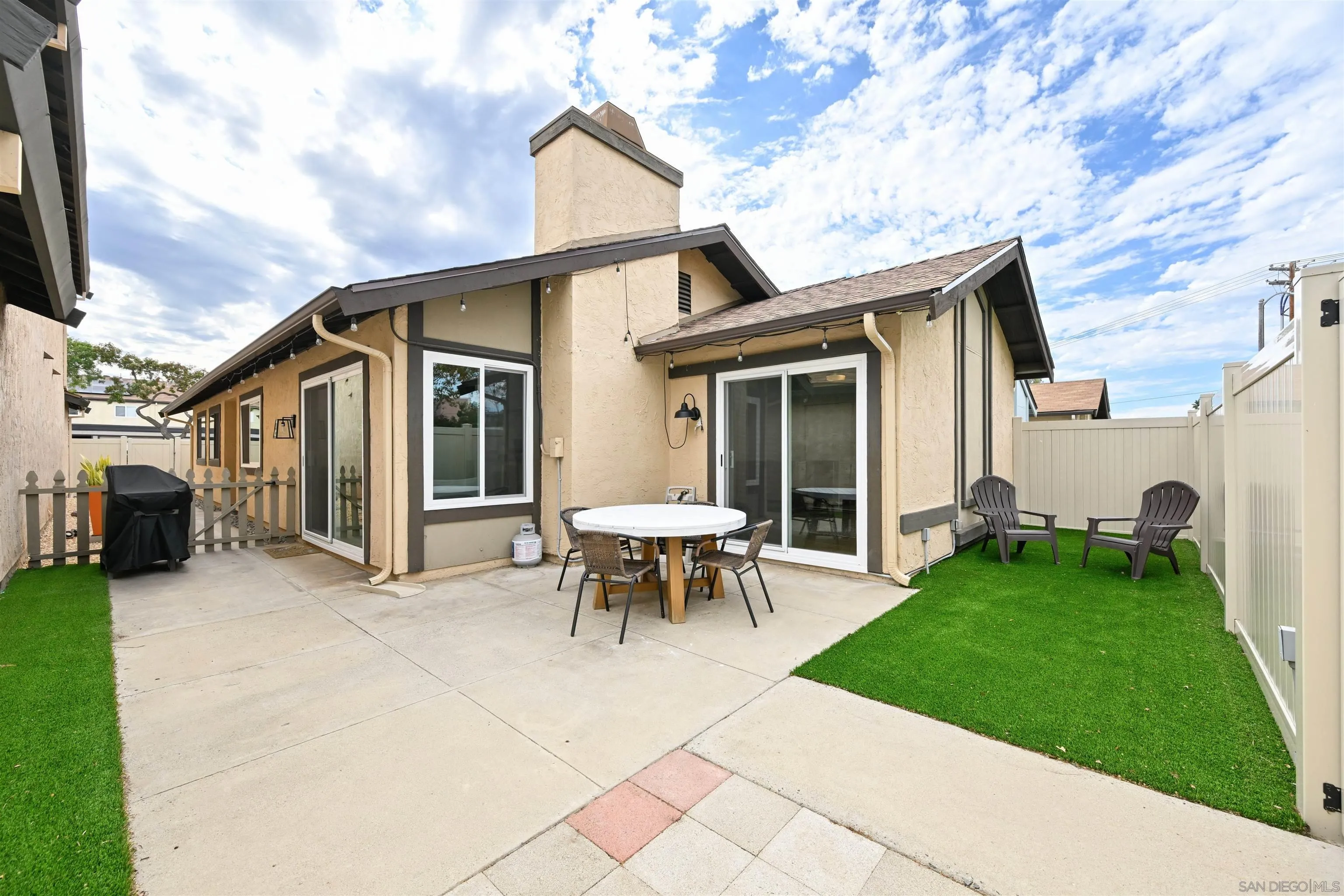 10314 Rochelle Avenue Santee, CA 92071 - Photo 15 of 25 a view of a house with backyard sitting area and garden