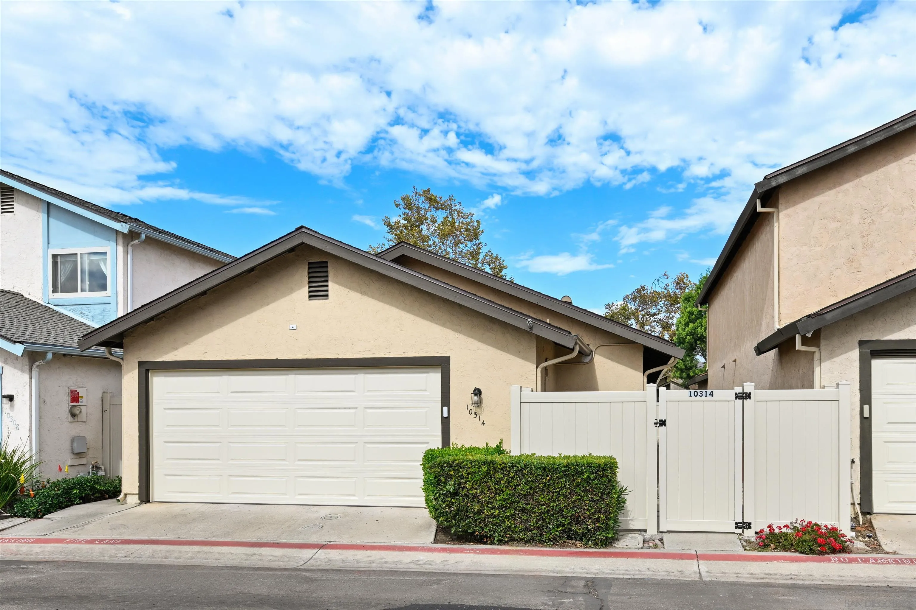 10314 Rochelle Avenue Santee, CA 92071 - Photo 19 of 25 a view of white house with a yard and garage