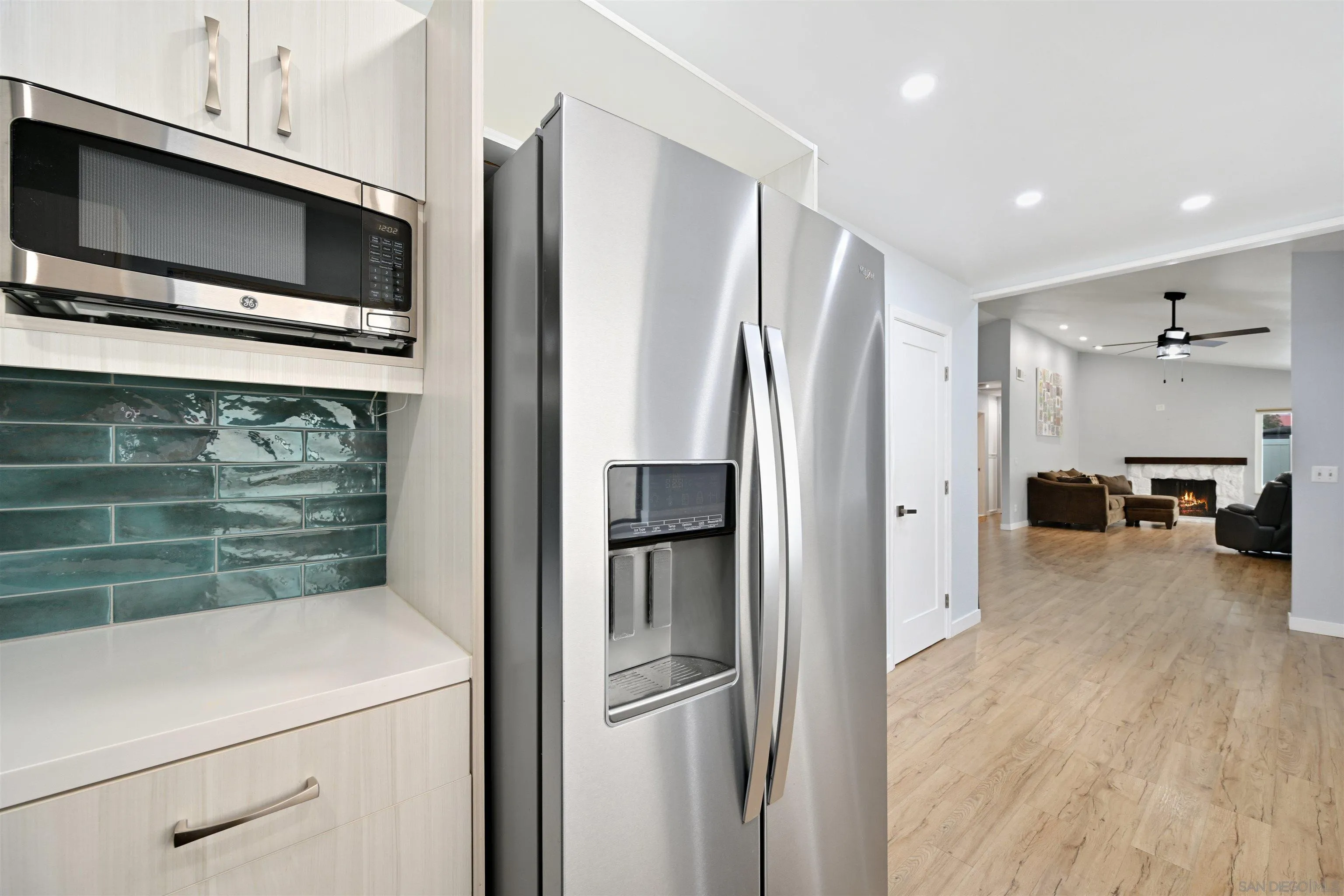 10314 Rochelle Avenue Santee, CA 92071 - Photo 4 of 25 a kitchen with stainless steel appliances a refrigerator and a stove top oven