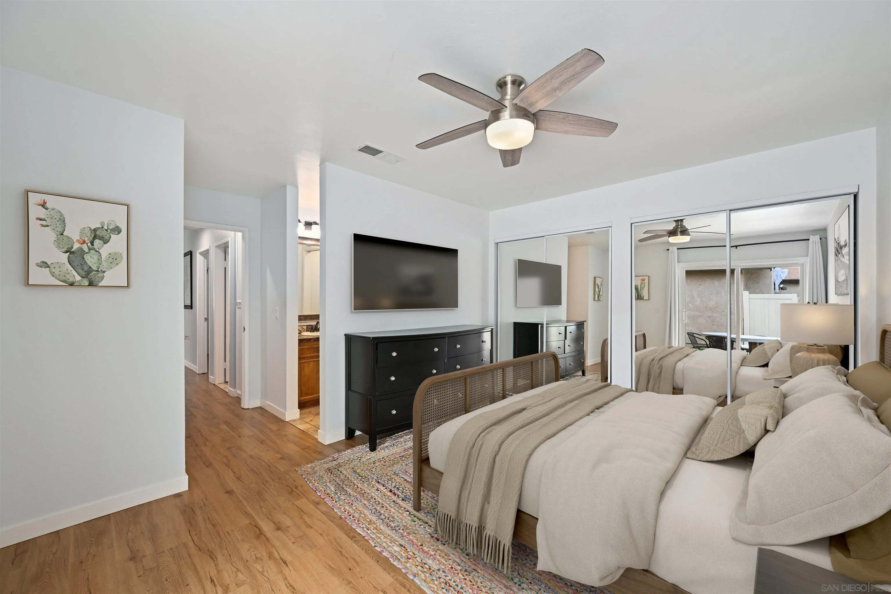 10314 Rochelle Avenue Santee, CA 92071 - Photo 9 of 25 a bedroom with a bed and a flat screen tv