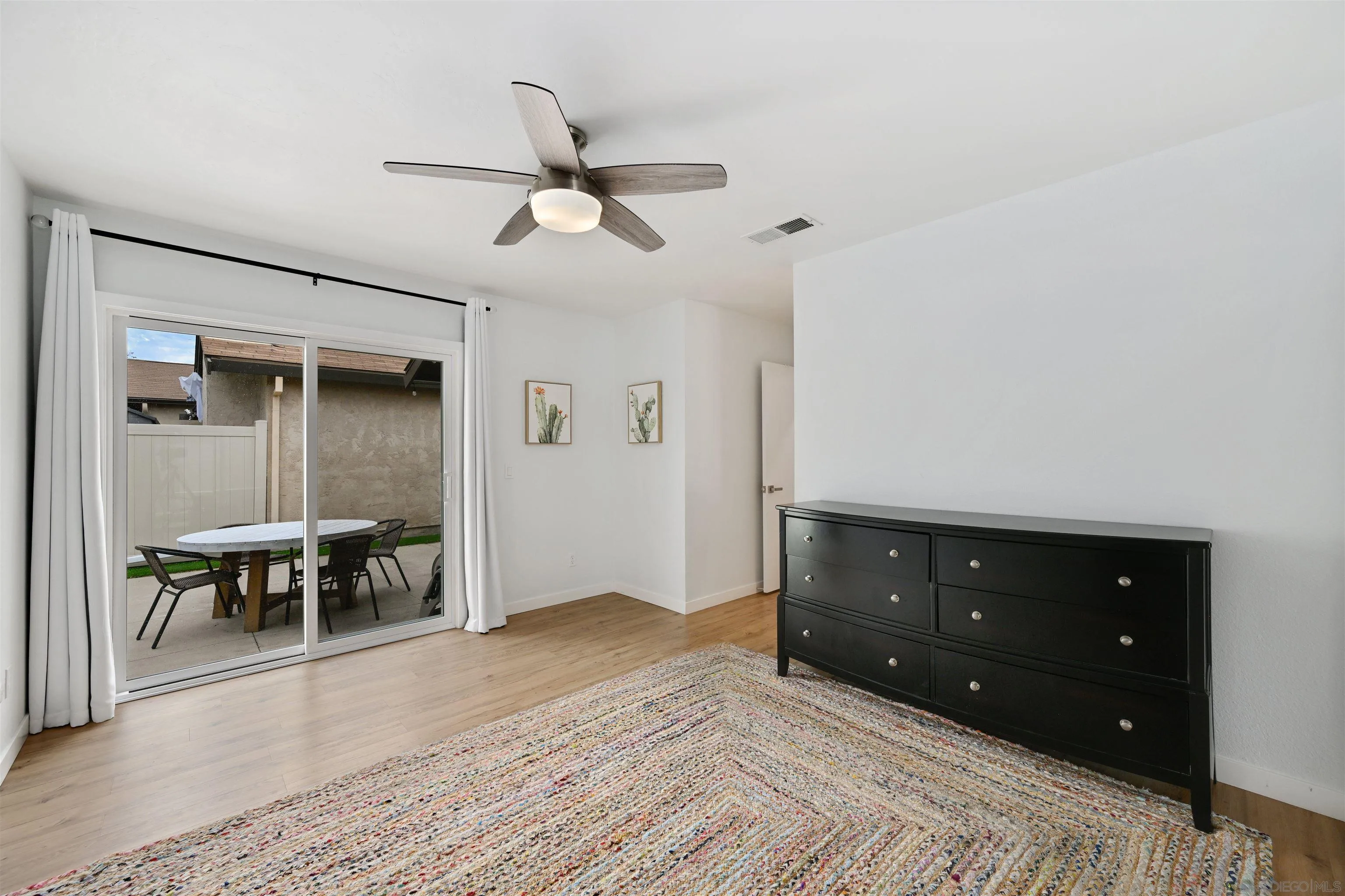 10314 Rochelle Avenue Santee, CA 92071 - Photo 10 of 25 a bedroom with a bed and a table