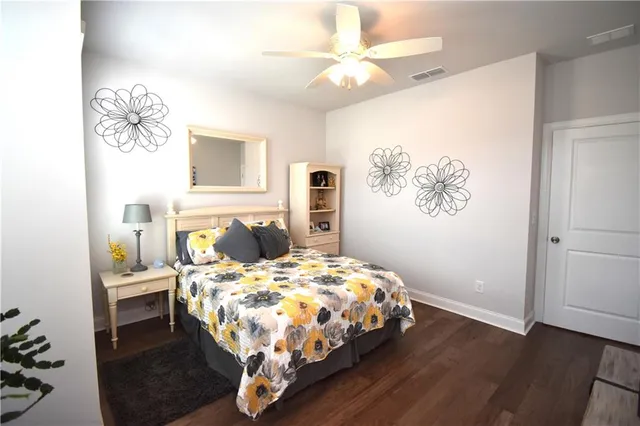 a bedroom with a bed and a table