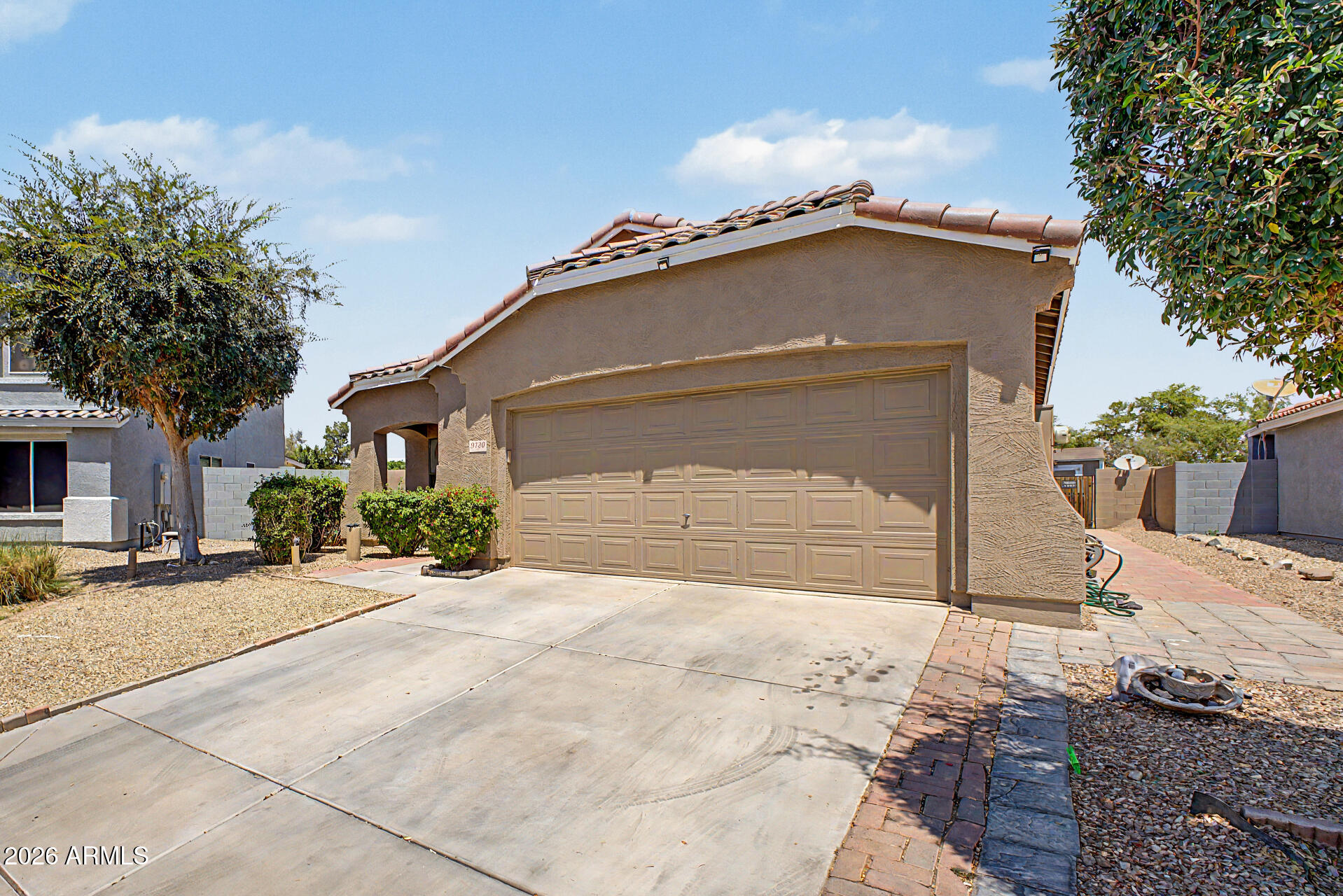 9730 West Payson Road Tolleson, AZ 85353 - Photo 4 of 57 a front view of a house with a yard