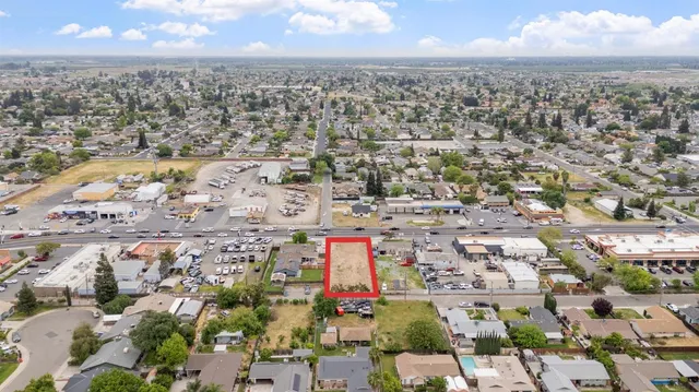 an aerial view of a city with parking
