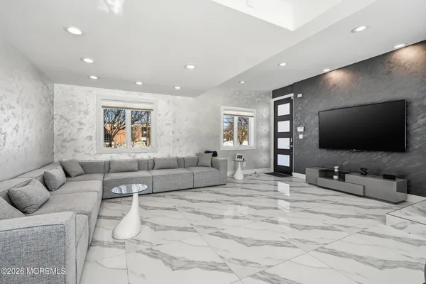 a living room with furniture and a flat screen tv