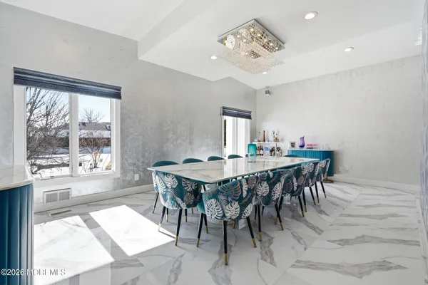 a view of a dining room with furniture window and outside view